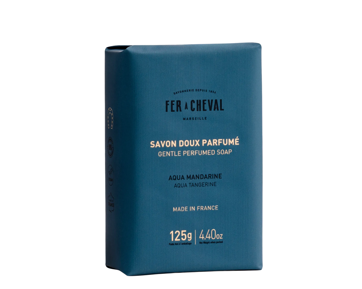 Blue soap packaging with white text on a white background