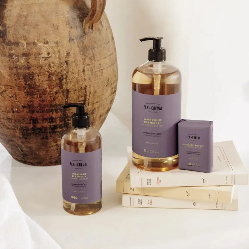 Bath and body products with a rustic vase on a white surface