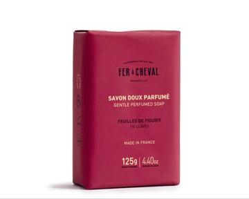 Red soap bar with branding on a white background