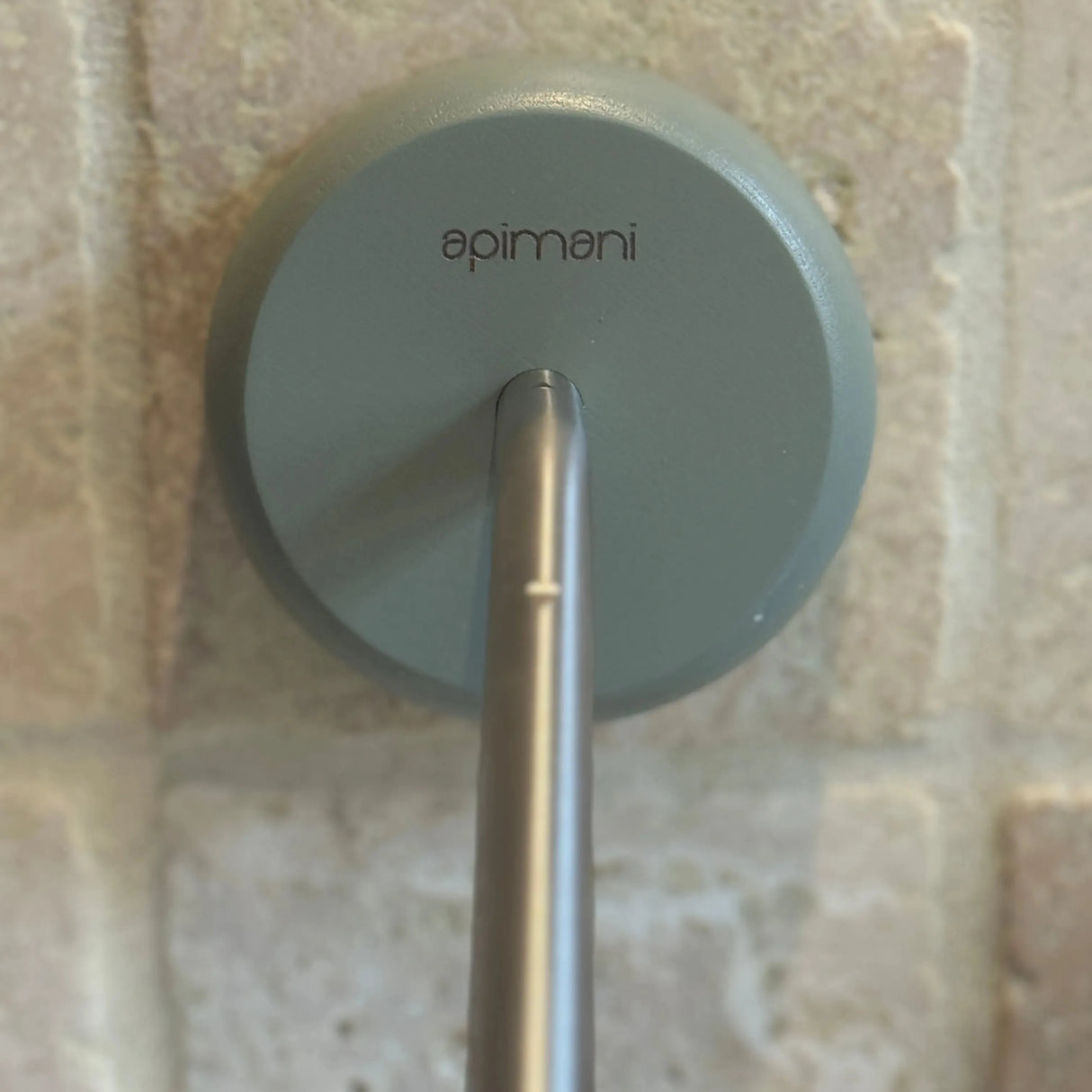 Apimani Olive Wood Soap Holder against a tiled wall