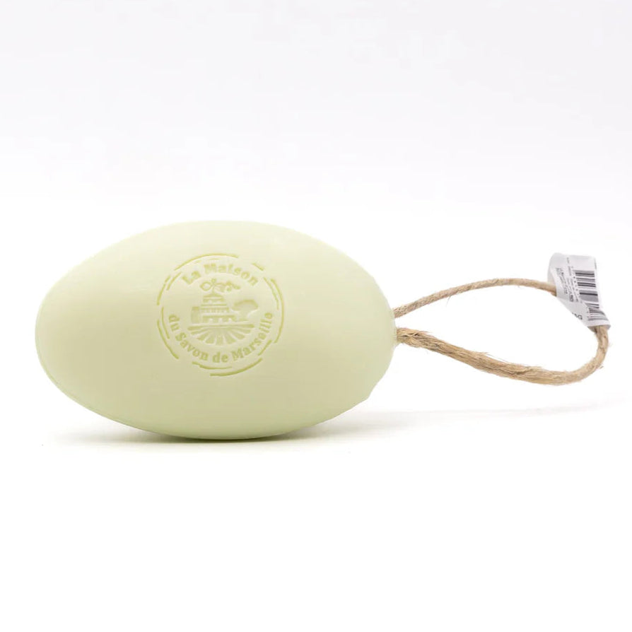 Light green bar of soap on a rope with a visible brand logo against a white background