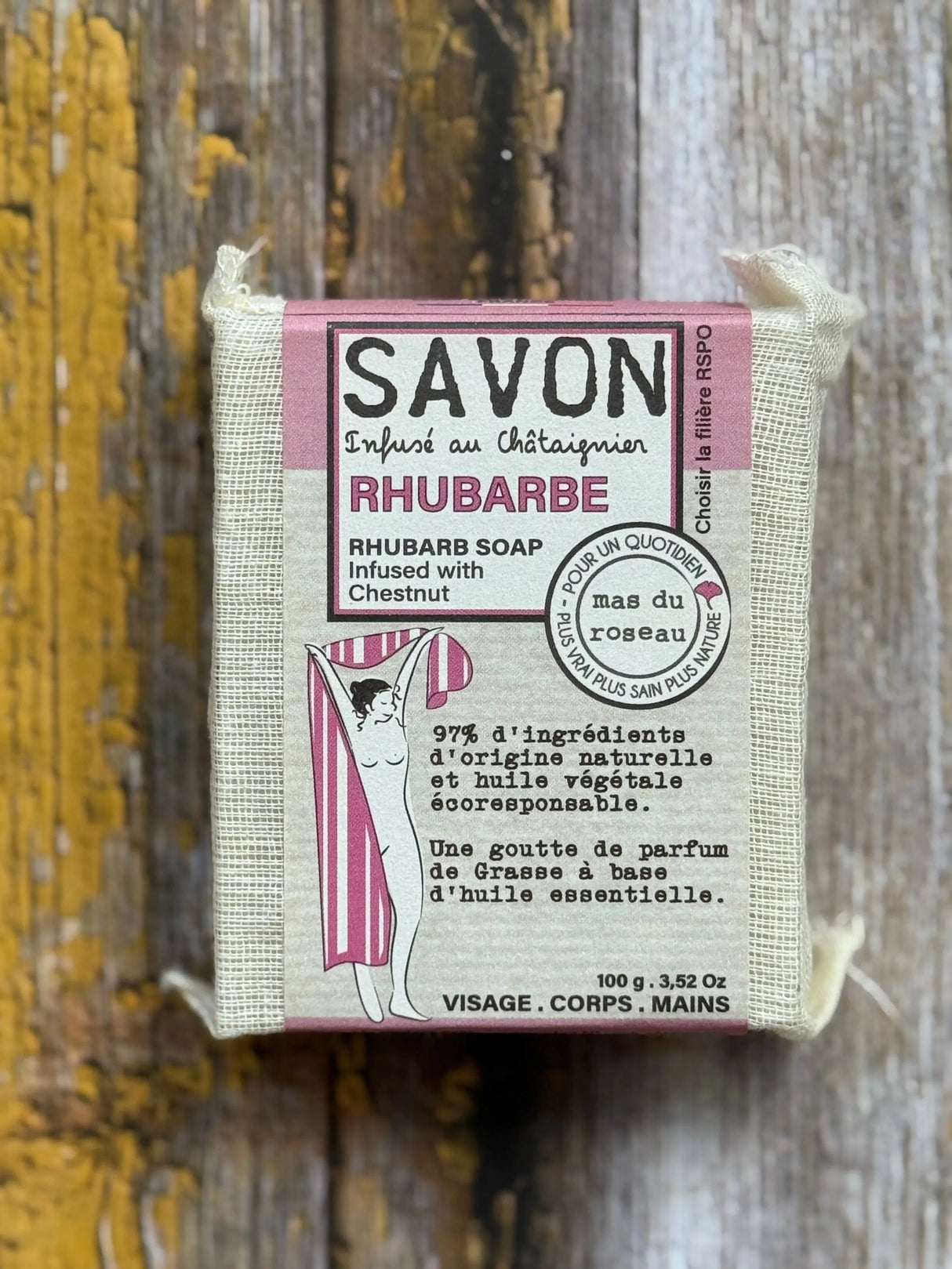 Rhubarb Bar of rhubarb soap with packaging on a wooden background