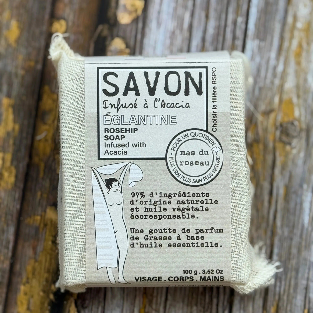 Rosehip Bar of soap with packaging on a wooden surface