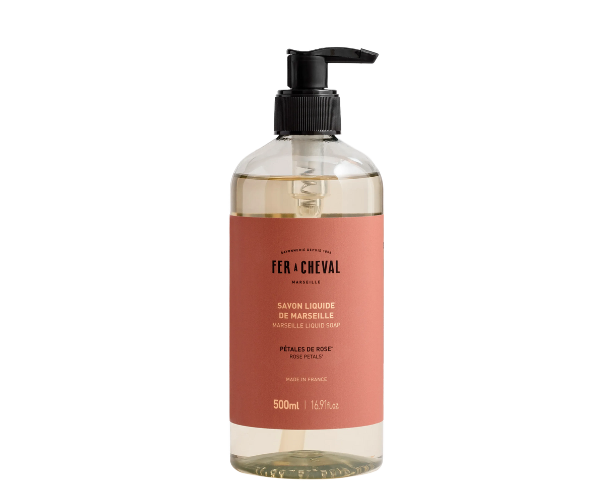 Bottle of Fx Cheval liquid soap with a pump on a white background
