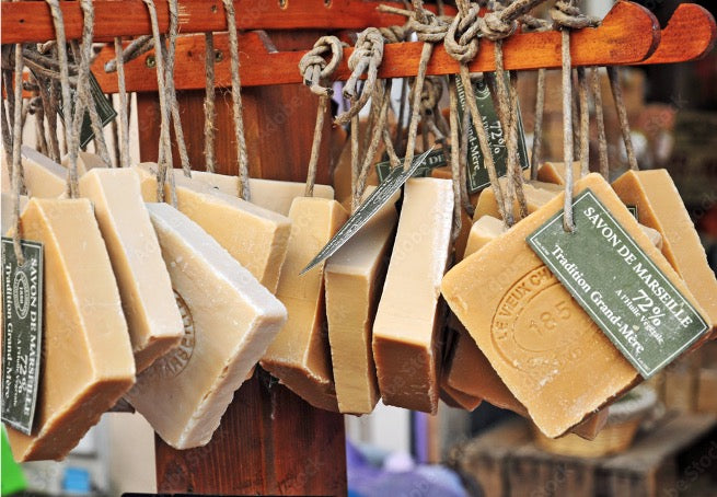 Squares of Savon de Marseille hanging on a rope