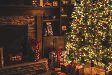 christmas tree with presents underneath in the evening