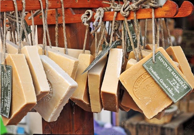Squares of Savon de Marseille hanging on a rope