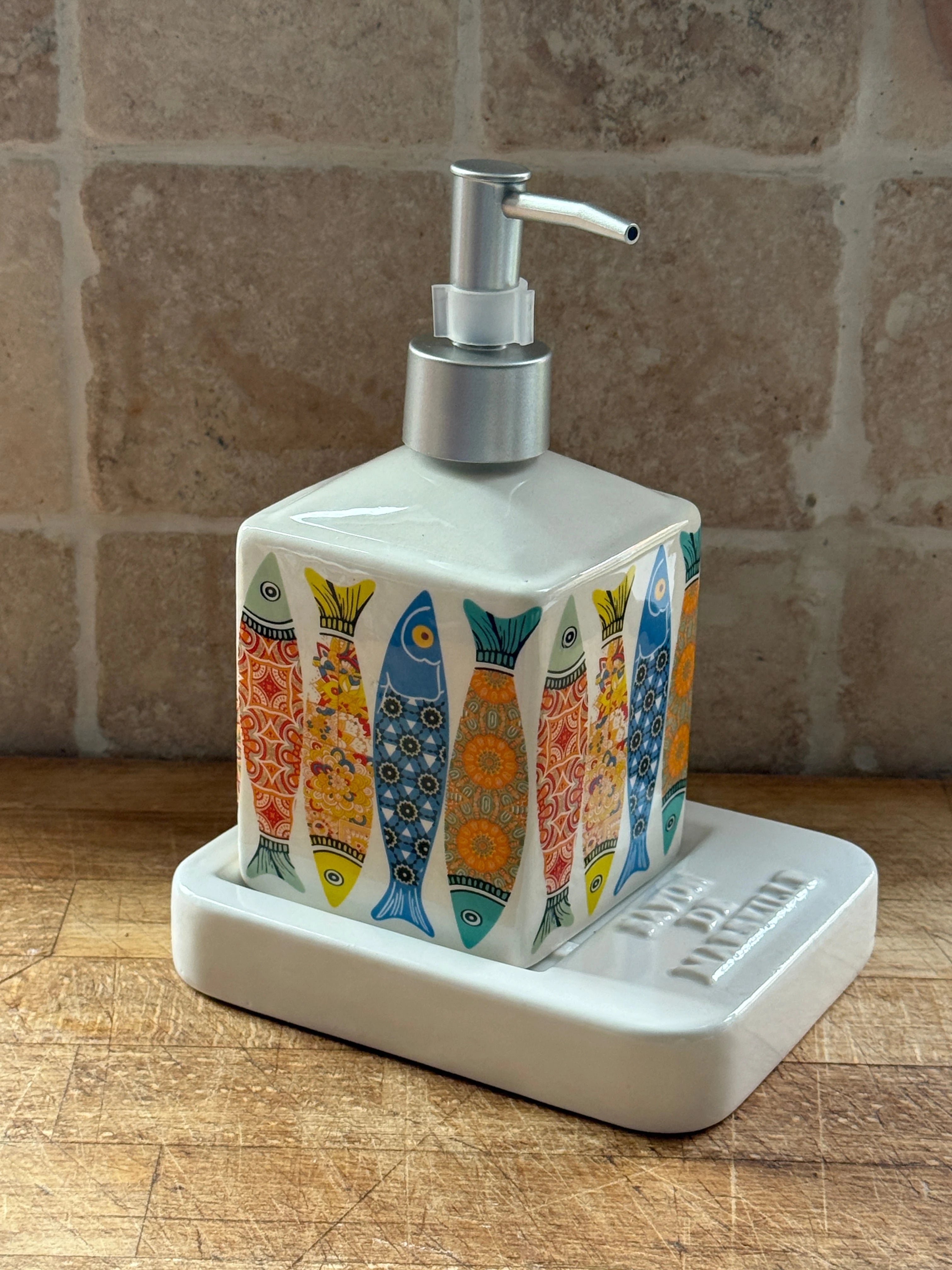Sardine Ceramic Liquid Soap Dispenser, sitting on a Square ceramic soap dish