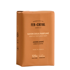 Brown soap packaging with 'Fer a Cheval' branding on a white background.