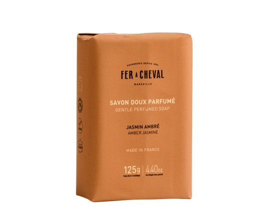 Brown soap packaging with 'Fer a Cheval' branding on a white background.