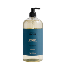 Bottle of Marseille Liquid Soap with a blue label on a white background