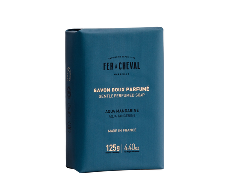 Blue soap packaging with white text on a white background