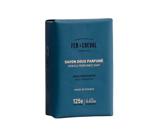 Blue soap packaging with white text on a white background