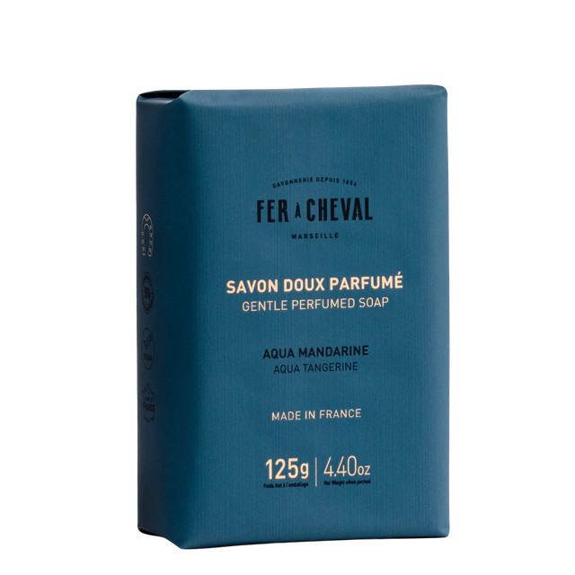 Blue soap packaging with white text on a white background