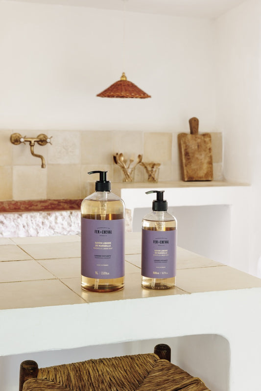 Two bottles of 'Fur & Fur' products on a bathroom counter with a neutral color scheme.