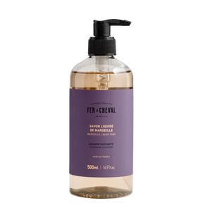 Bottle of Fé ç Cheval liquid soap with a pump on a white background