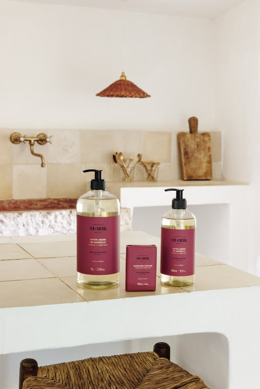 Bathroom setting with two bottles of Skindinavia products on a counter.