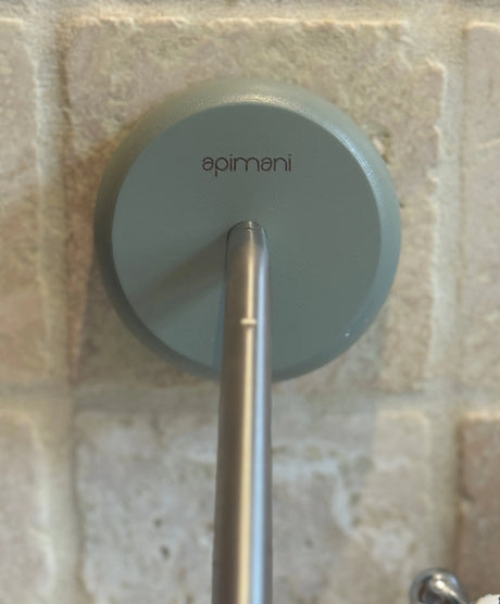 Apimani Olive Wood Soap Holder against a tiled wall