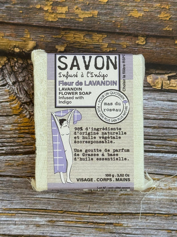 Lavender Flower Bar of soap with a label on a wooden surface