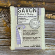 Lavender Flower Bar of soap with a label on a wooden surface