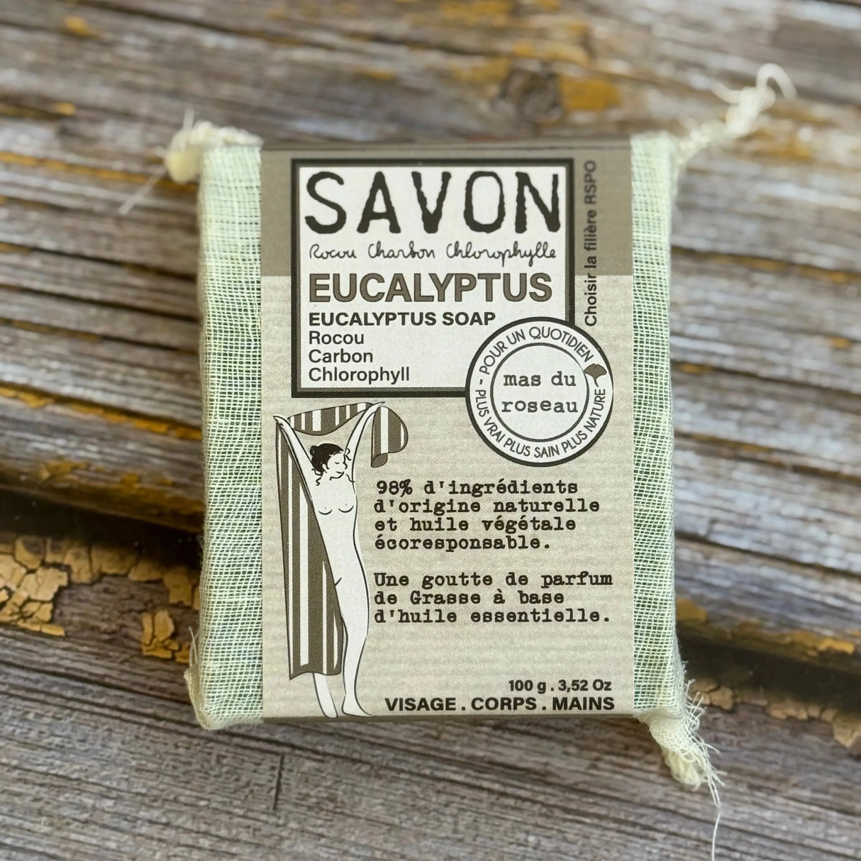 Eucalyptus soap bar with packaging on a wooden surface