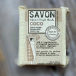 Bar of soap with 'Savon' label on a natural background