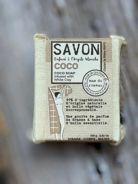 Bar of soap with 'Savon' label on a natural background