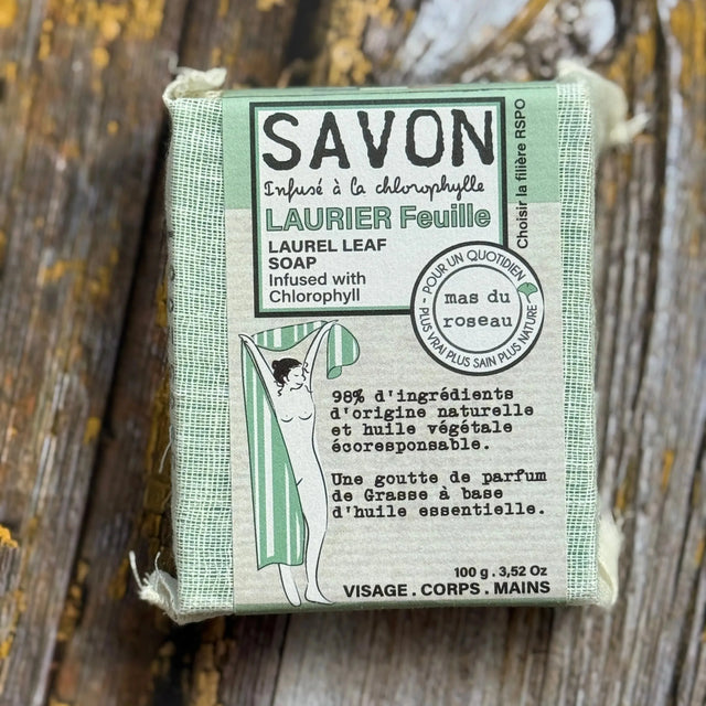 Laurel Leaf Bar of soap with a green box on a wooden surface