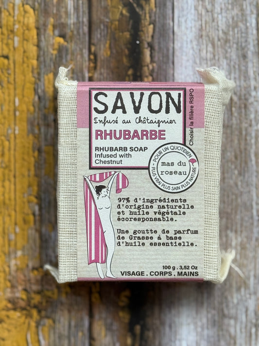 Rhubarb Bar of rhubarb soap with packaging on a wooden background
