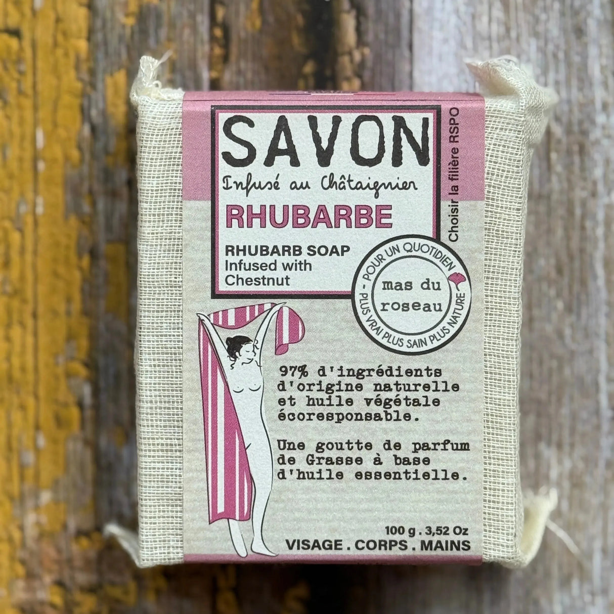 Rhubarb Bar of rhubarb soap with packaging on a wooden background