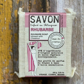 Rhubarb Bar of rhubarb soap with packaging on a wooden background