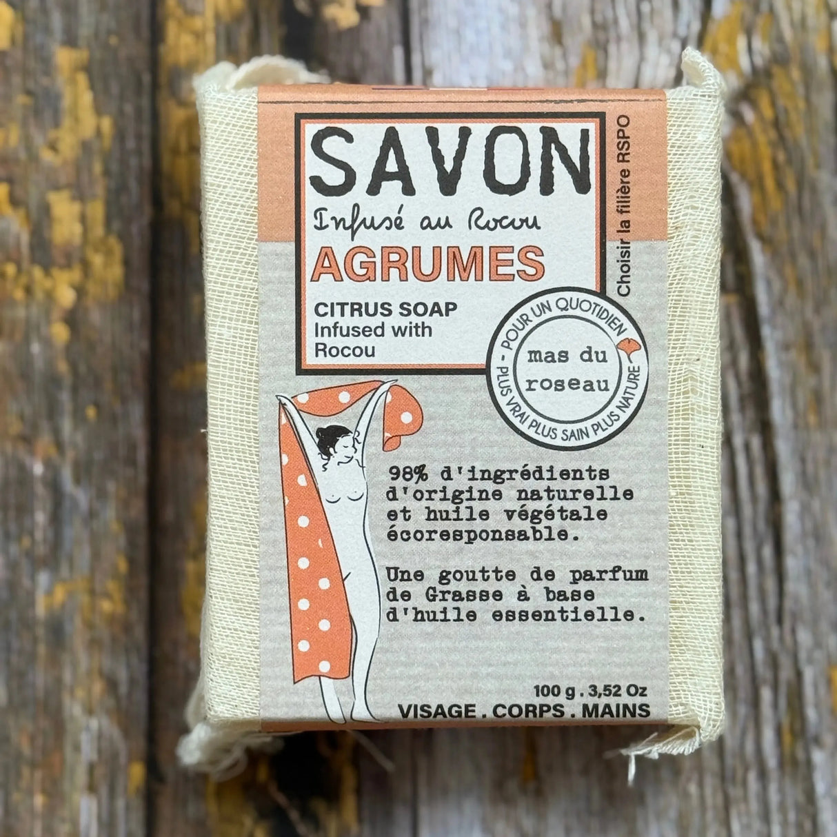 Citrus Bar of soap with a label on a wooden background