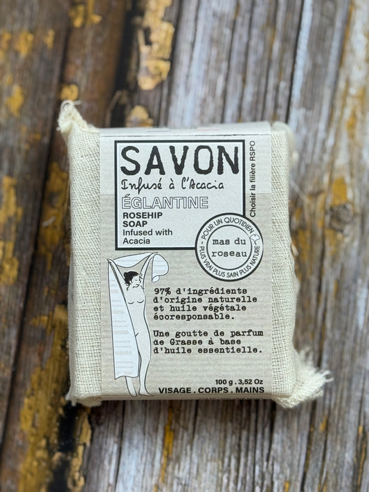 Rosehip Bar of soap with packaging on a wooden surface