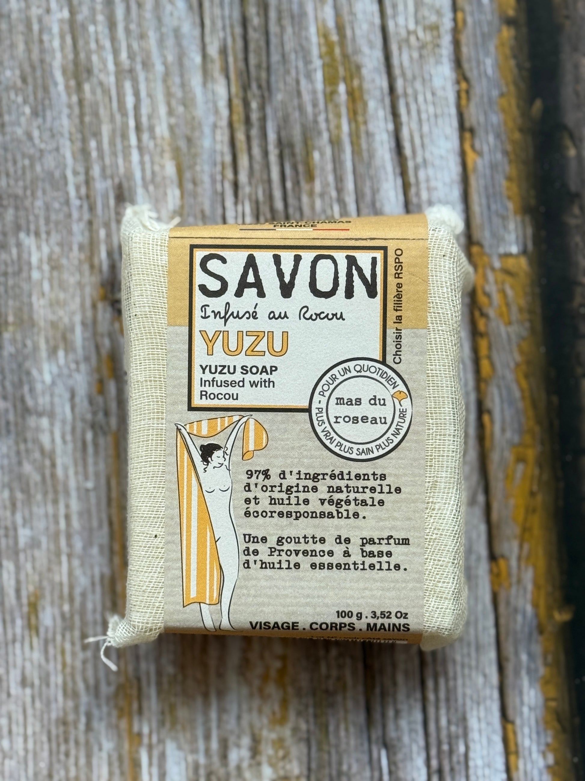 Yuzu soap bar with packaging on a wooden surface