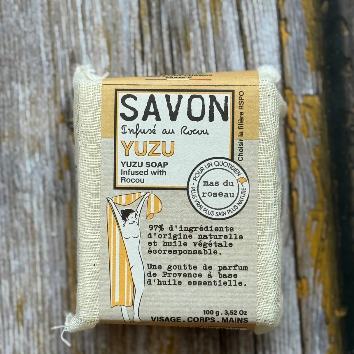 Yuzu soap bar with packaging on a wooden surface