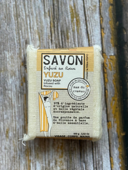 Yuzu soap bar with packaging on a wooden surface