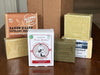 Collection of Argan oil French soap bars and packaging on a wooden surface