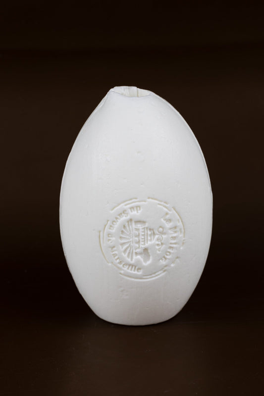 A large white rotating wall soap made with organic Donkey Milk. Donkey Milk Soap on a Rope. French Donkey Milk Soap