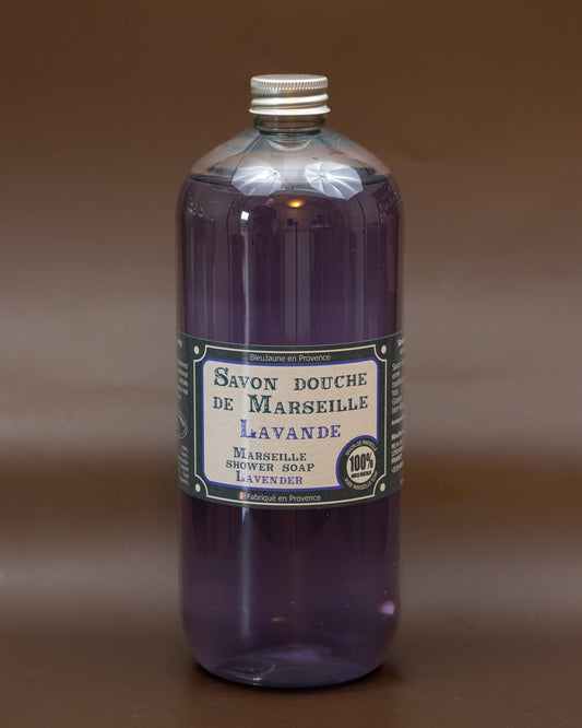 A clear bottle containing purple liquid soap with a label that reads 'Savon douche de Marseille Lavande'.